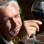 Portrait of man observing color in wine Portrait of man observing color in wine