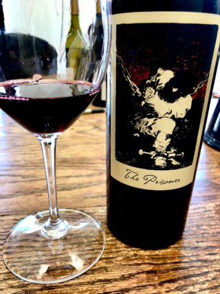 alt="The Prisoner Red Wine bottle and glass"