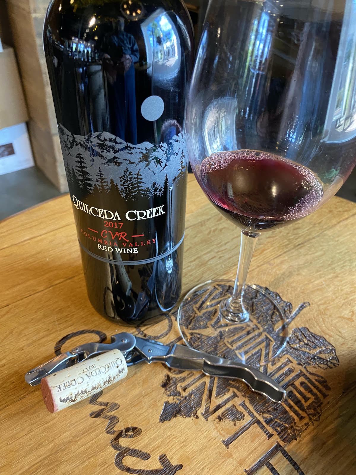 alt="Quilceda Creek 2017 CVR Red Wine bottle and glass"