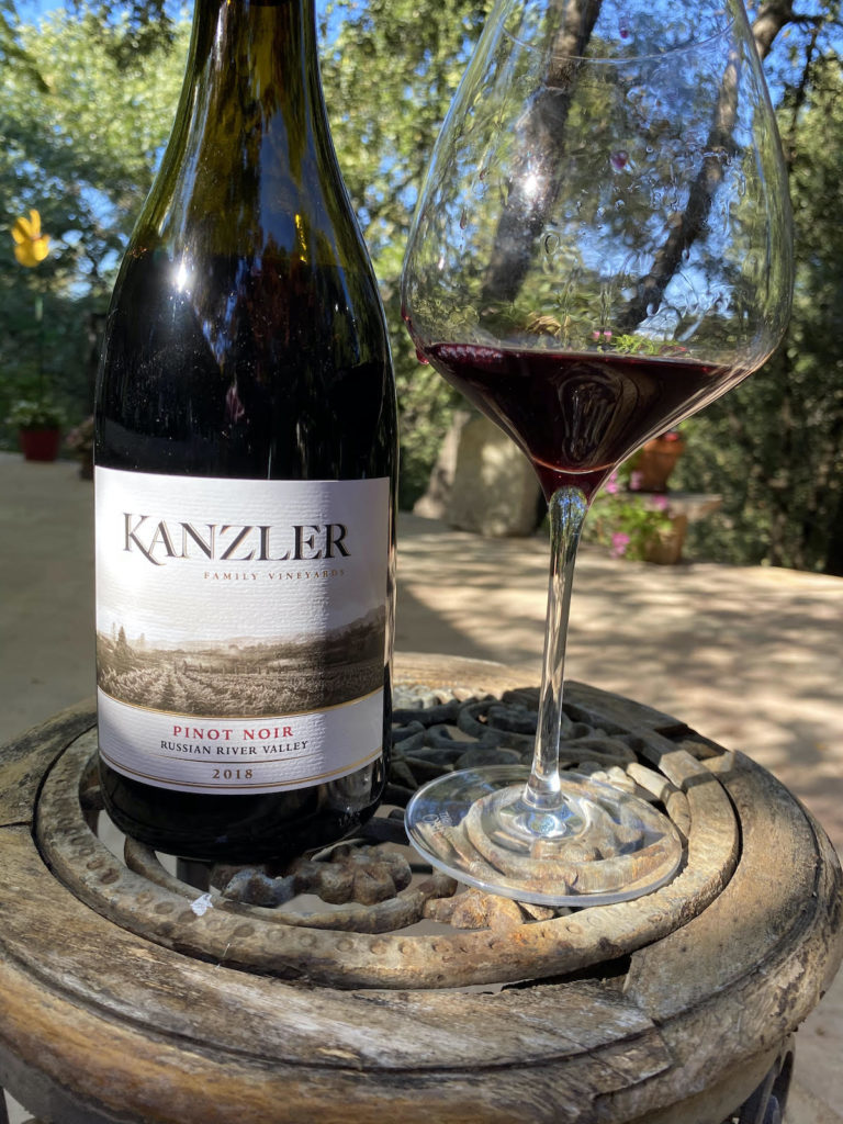 alt="Kanzler 2018 Russian River Valley Pinot Noir bottle and glass"