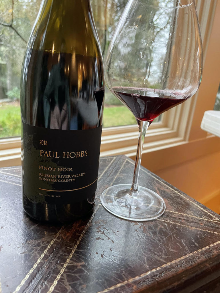alt="Paul Hobbs 2018 Russian River Valley Pinot Noir bottle and glass"