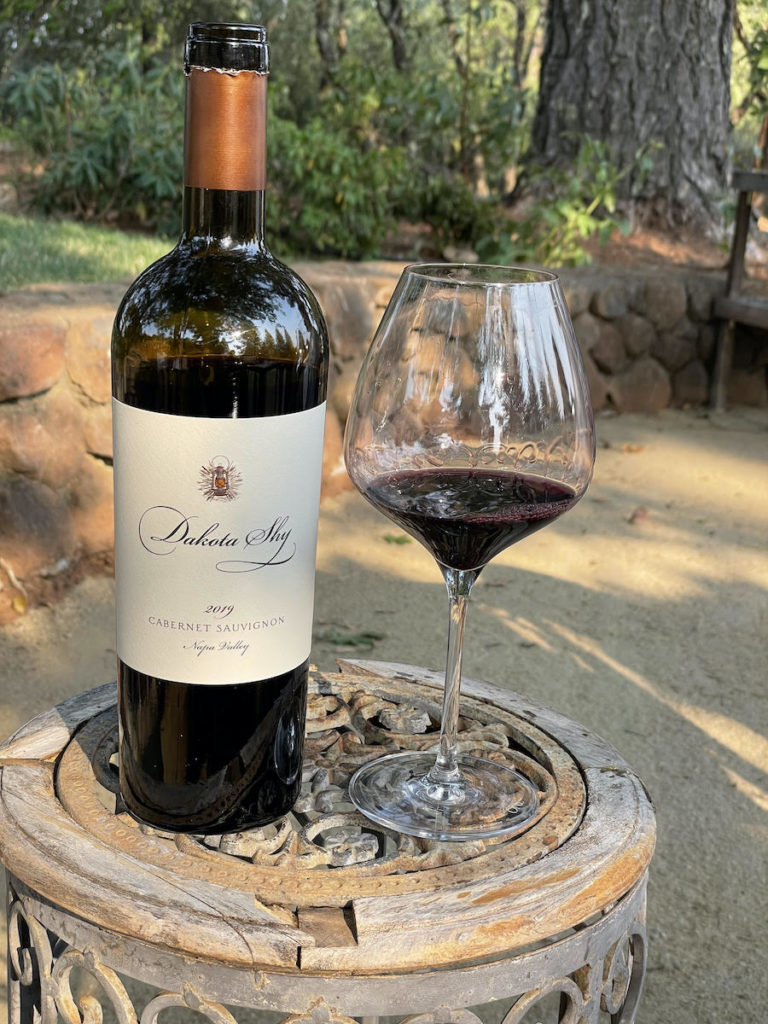 alt="Dakota Shy Napa Valley Cabernet Sauvignon bottle and glass"