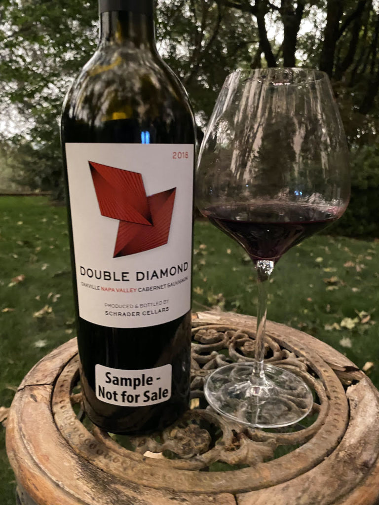 alt="Double Diamond 2018 Oakville Cabernet Sauvignon bottle and glass"