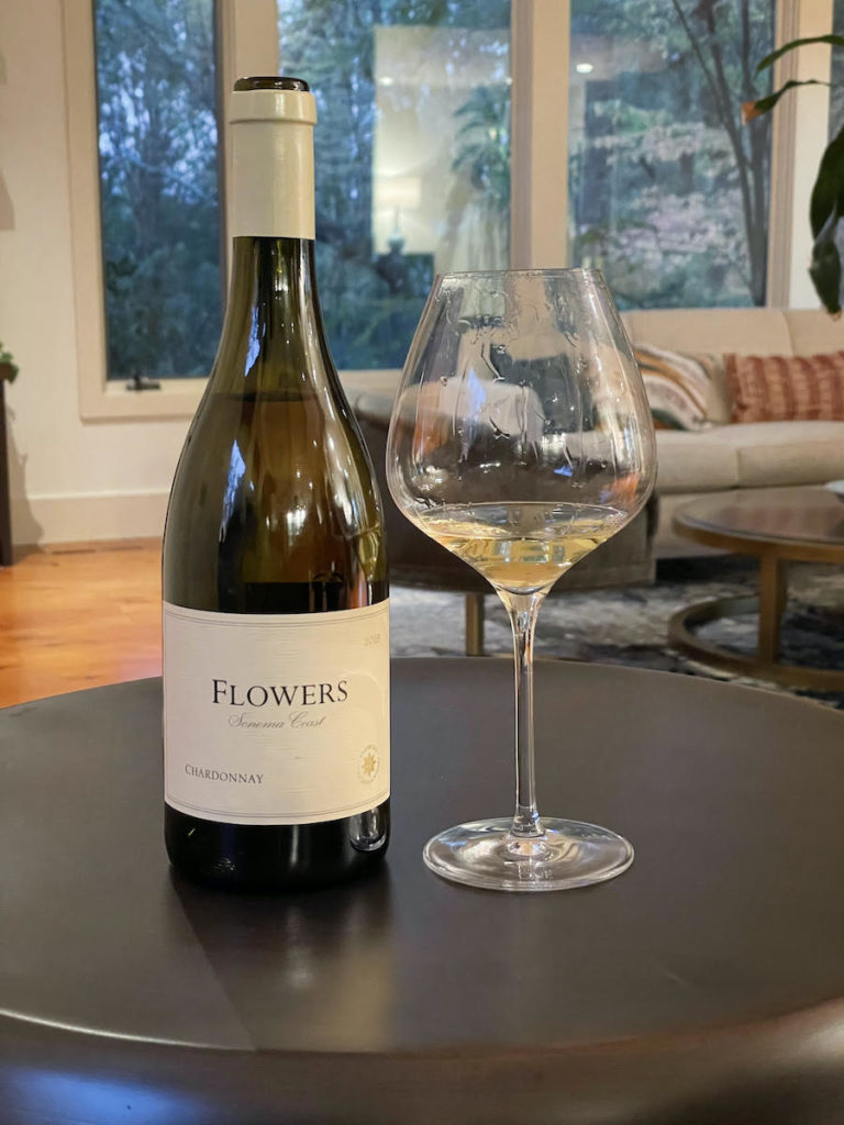 alt="Flowers 2019 Sonoma Coast Chardonnay bottle and glass"