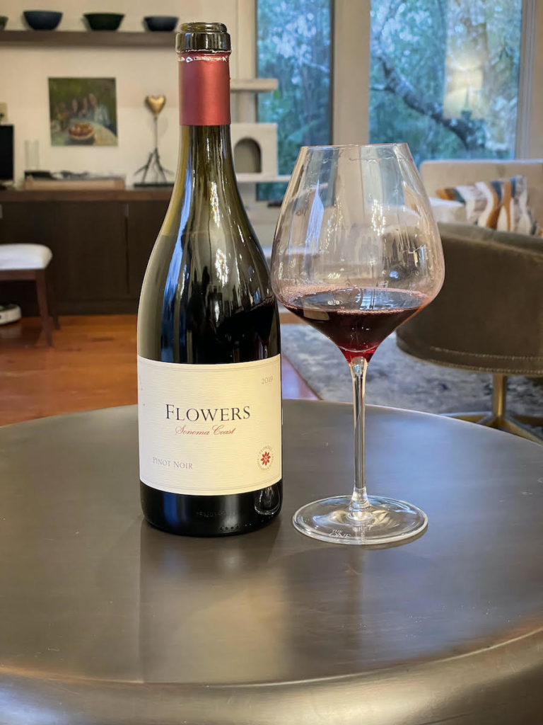 alt="Flowers 2019 Sonoma Coast Pinot Noir bottle and glass"