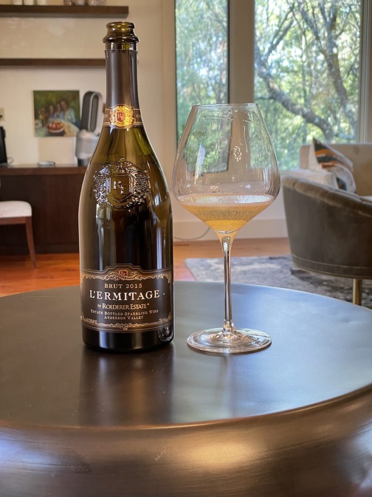 alt="Roederer Estate 2015 L'Ermitage Sparkling Wine bottle and glass"