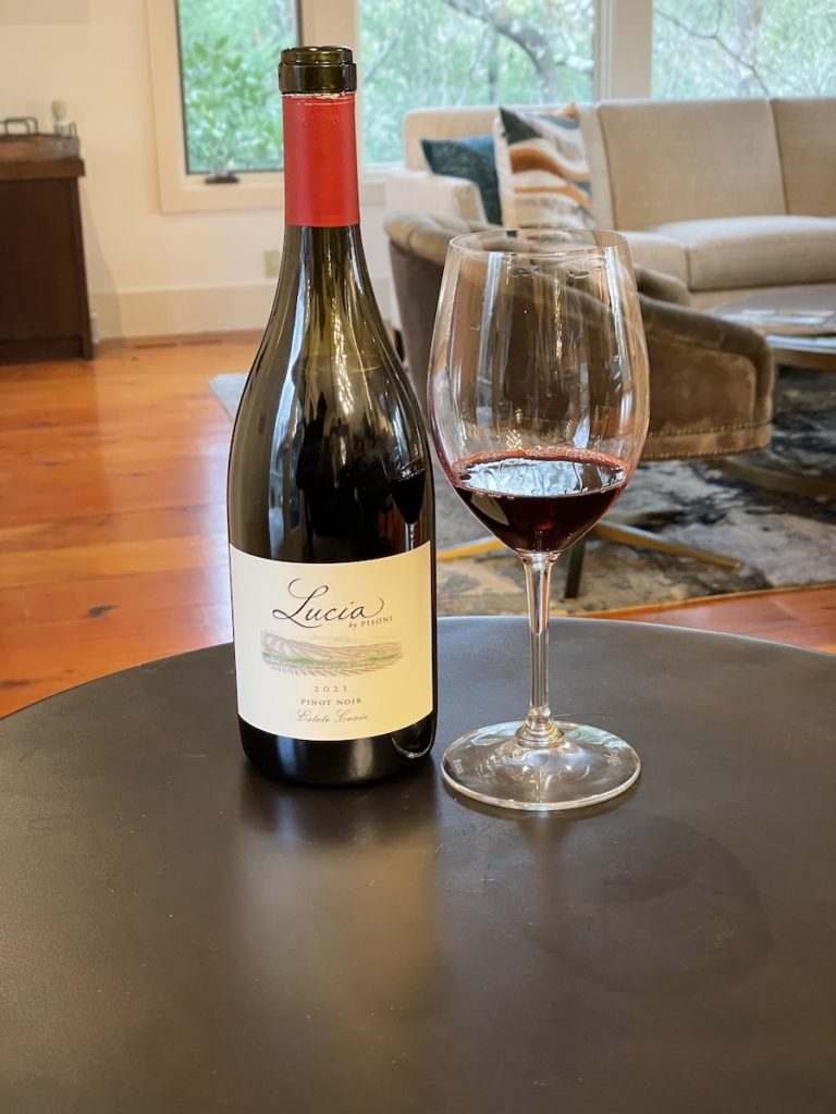 alt="Lucia Estate Cuvée Pinot Noir bottle and glass"
