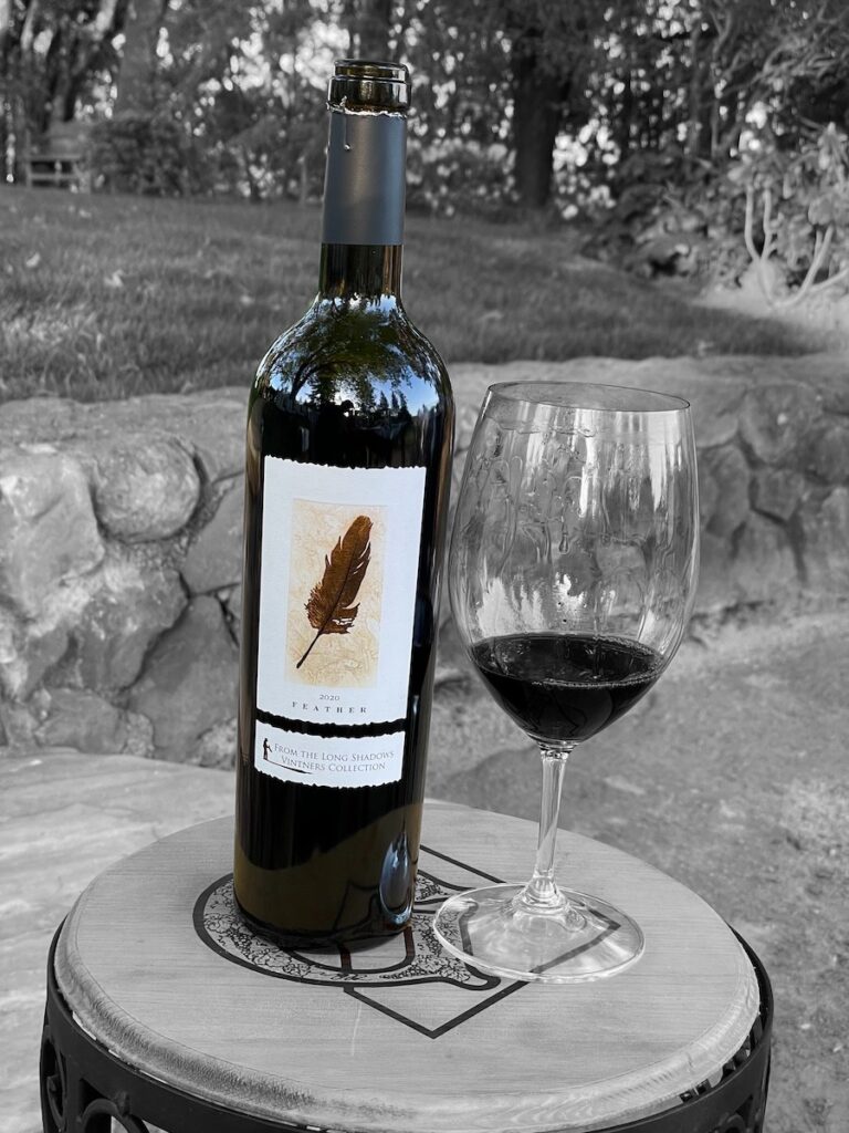 Feather Cabernet Sauvignon bottle and glass on table