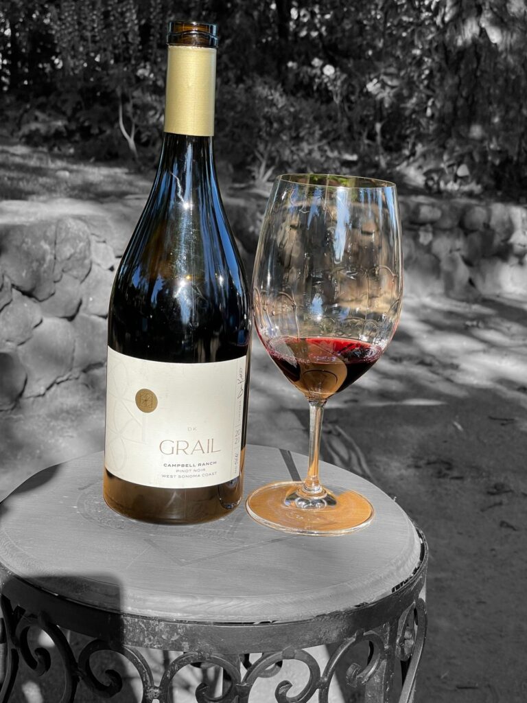 alt="Grail Campbell Ranch Pinot Noir bottle and glass"